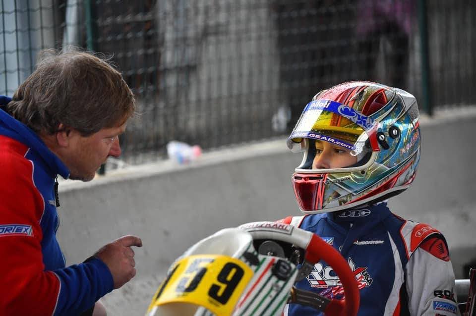 Dan Schlosser Gives Luca Mars a Pep Talk While He Sits on Grid in His Tony Kart.