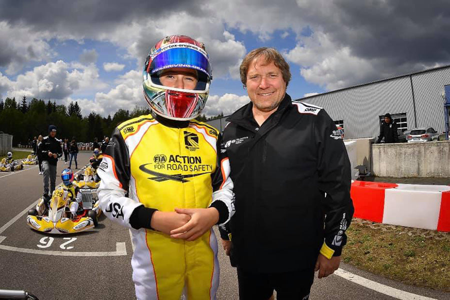 Pittsburgh Karting Instructor from PKC, Dan Schlosser, Poses with IMSA Driver Luca Mars on the FIA Karting Academy Trophy Grid.